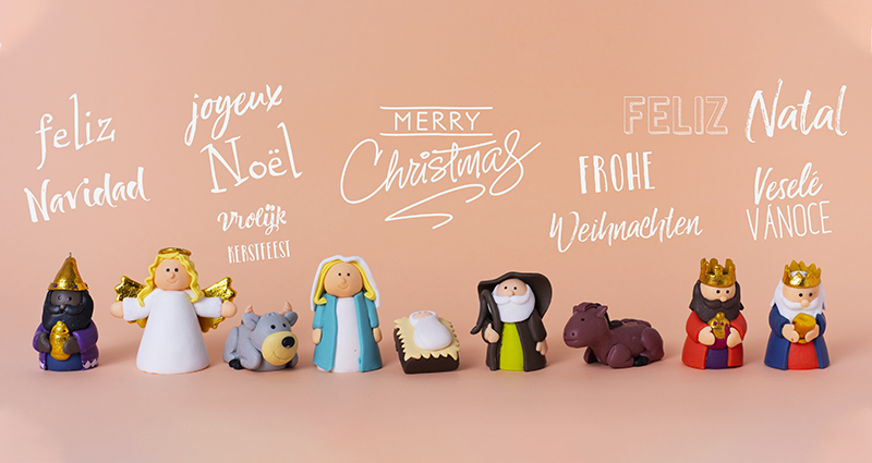 Weihnachtssymbole und -wünsche in verschiedenen Sprachen