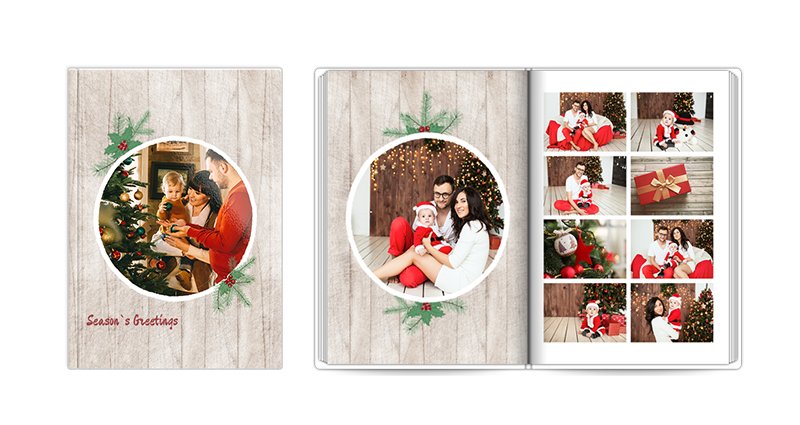 Season’s Greeting, a template of a photobook – a photo of a closed and open book.