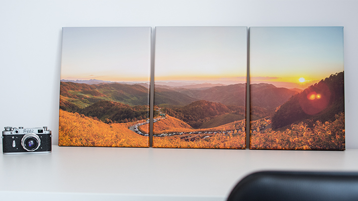 Triptych photo canvas on a desk