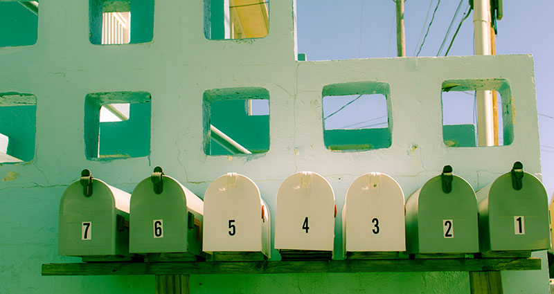 A row of green mailboxes.