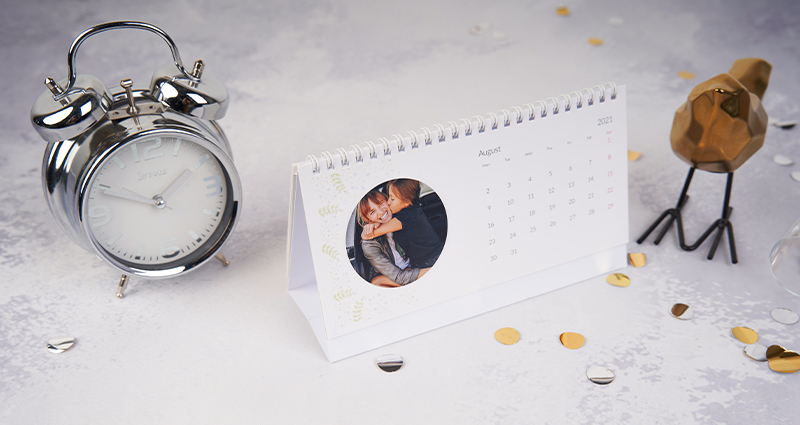 A desk calendar standing on a desk.