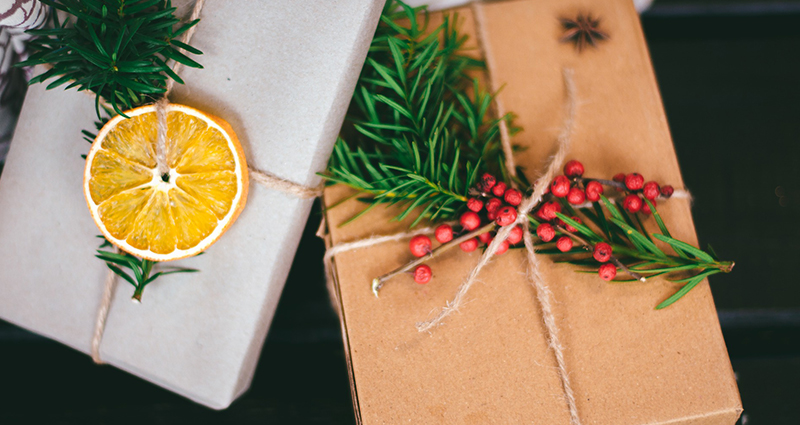 A gift decorated with lemon and mountain ash.