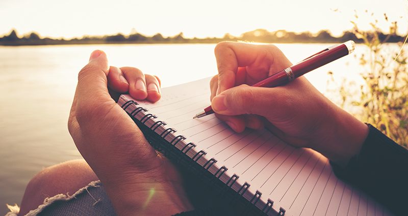 A person is writing quotes in a Yearbook. What to write in a Yearbook