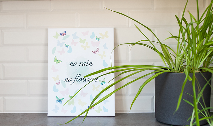 Canvas with a motivational quote on a countertop