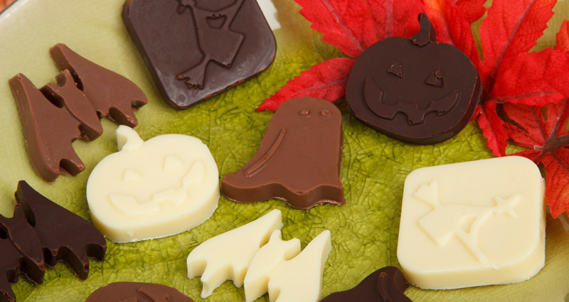 Halloween chocolate in the form of ghosts, witches, pumpkins and bats.