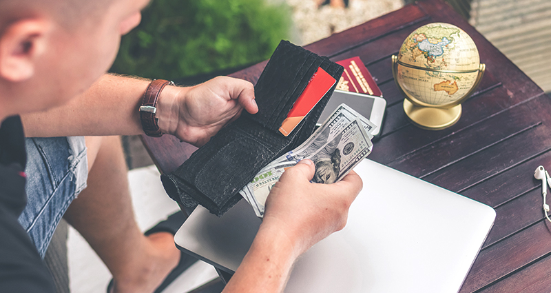 Man pulling money from a wallet