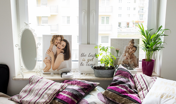 Photo canvases on a window sill