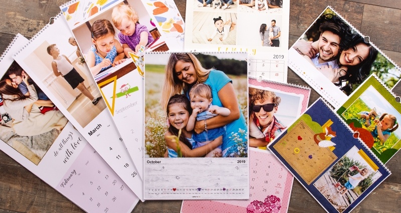 Colorland’s photo calendars (various formats) lying on a wooden floor