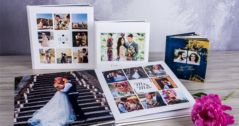 Luxury wedding albums in 4 formats, one of them is opened flat