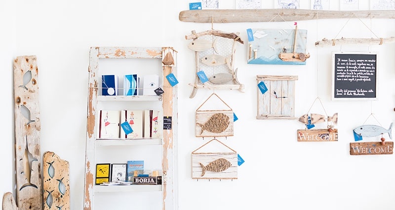 DIY wall with wooden shelves and decorations.